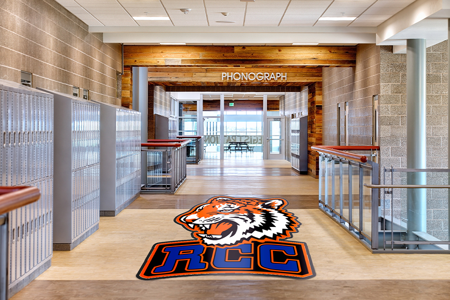 Custom shaped logo mat in school hallway — RCC Tigers